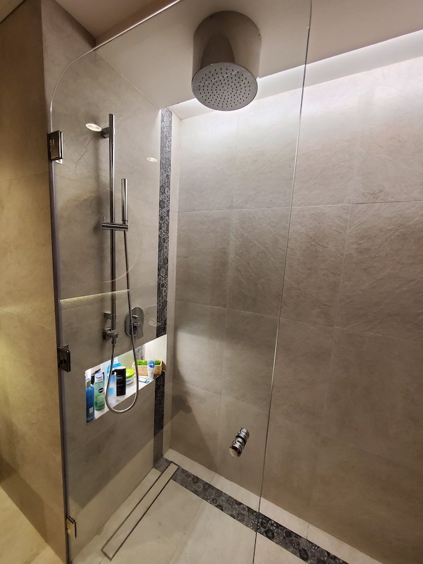 bathroom renovations in dubai discovery gardens, villa renovations, interior designer in dubai, walk in shower, industrial style, round mirror led lighting