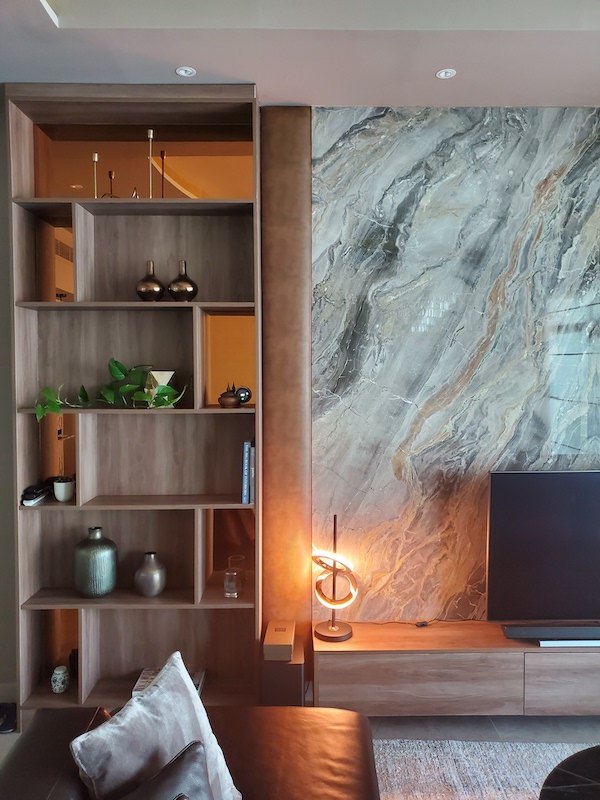 luxurious interior decor palm jumeirah, dubai interior designer, marble feature., custom furniture, gypsum ceiling, led lighting, book shelves with rose gold
