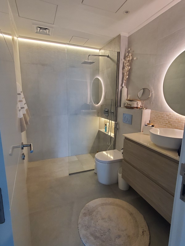 master bathroom remodeling, dubai marina home renovations. fitout dubai.jpg, interior designer dubai homes. round mirror. bathroom makeover