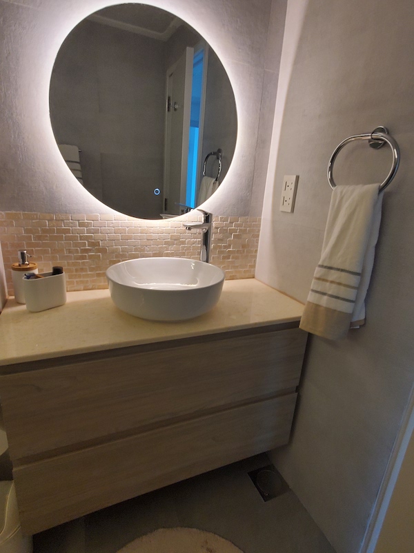 master bathroom remodeling, dubai marina home renovations. fitout dubai.jpg, interior designer dubai homes. round mirror. bathroom makeover