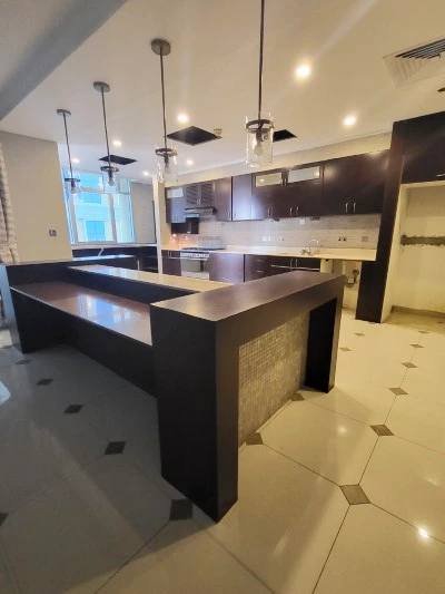 Dubai marina crown kitchen upgrade, dubai marina kitchen design, moden kitchen design, professional kitchen design, before and after, wooden counter, wooden island, white cabinets, modern kitchen design, interior design, storage upgrade, kitchen designer