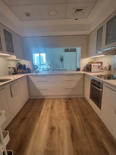 kitchen upgrade, wrapping, flooring, tiling, cabinet upgrade, greens kitchen upgrade, interior design, kitchen design, greens modern designer, dubai, greens, greens kitchen before and after, white cabinets, wooden flooring modern